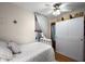 This bedroom features neutral walls, wood-look flooring, and an off-white closet at 30 E Key Ave, Eustis, FL 32726