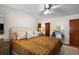Comfortable bedroom featuring soft lighting, neutral decor, and light-colored walls at 30 E Key Ave, Eustis, FL 32726