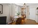 Cozy dining area features a decorative cabinet and a round wooden table at 30 E Key Ave, Eustis, FL 32726