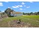 Exterior side view of a single-Gathering home in a residential neighborhood at 30 E Key Ave, Eustis, FL 32726
