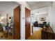 Hallway view with hardwood floors and an arched doorway leading to a bright living area at 30 E Key Ave, Eustis, FL 32726