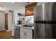Bright kitchen features stainless steel appliances, open shelving and an undermount sink at 30 E Key Ave, Eustis, FL 32726