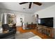 Inviting living space with hardwood floors and natural light, creating a warm atmosphere at 30 E Key Ave, Eustis, FL 32726
