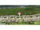 An aerial view showing residential neighborhood with mature trees throughout and community layout at 3060 Neverland Dr, New Smyrna Beach, FL 32168