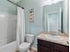 Bathroom featuring a vanity with solid surface countertop, toilet, shower and tub combination at 3060 Neverland Dr, New Smyrna Beach, FL 32168