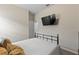 Bedroom featuring a full-sized bed, neutral walls and an overhead television set at 3060 Neverland Dr, New Smyrna Beach, FL 32168