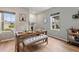 Bright dining room features wood table, upholstered bench and chairs, and a decorative accent wall at 3060 Neverland Dr, New Smyrna Beach, FL 32168