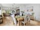 An inviting dining area with an open floor plan, featuring a stylish table set with elegant decor at 3060 Neverland Dr, New Smyrna Beach, FL 32168