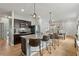 Open kitchen boasts a large island with barstool seating and seamlessly connects to the dining area at 3060 Neverland Dr, New Smyrna Beach, FL 32168