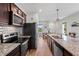 Open kitchen boasts a large island with barstool seating and seamlessly connects to the dining area at 3060 Neverland Dr, New Smyrna Beach, FL 32168
