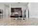 Well-equipped kitchen with stainless steel appliances, granite counters, and ample cabinet space at 3060 Neverland Dr, New Smyrna Beach, FL 32168
