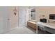 Home office featuring a writing desk, comfortable chair, bright window and minimalist decor at 3060 Neverland Dr, New Smyrna Beach, FL 32168