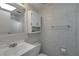 Clean bathroom with a functional layout, a white vanity, and a shower with a tub at 32335 Oak Park Dr, Leesburg, FL 34748