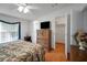 Comfortable bedroom with closet, bathroom access, and bright natural light from a large window at 32335 Oak Park Dr, Leesburg, FL 34748