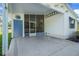 View of covered carport leading to a screened-in porch and featuring a convenient storage area at 32335 Oak Park Dr, Leesburg, FL 34748