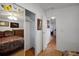 Main bedroom features a mirror closet and a hallway with hardwood floors at 32335 Oak Park Dr, Leesburg, FL 34748