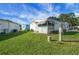 Charming single-story home with well-maintained lawn and screened-in porch, perfect for outdoor living at 32335 Oak Park Dr, Leesburg, FL 34748