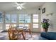 Enclosed lanai with tile flooring, bright lighting, and patio furniture creating a cozy atmosphere at 32335 Oak Park Dr, Leesburg, FL 34748