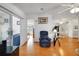 Open-concept living room with bright lighting and access to other rooms and the lanai at 32335 Oak Park Dr, Leesburg, FL 34748