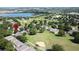 Expansive view of a neighborhood near a lake and golf course, showcasing its community layout at 3559 Chapel Hill Blvd, Clermont, FL 34711