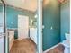 Bathroom featuring tile floors, vanity with mirror, and doorway leading to another room at 3559 Chapel Hill Blvd, Clermont, FL 34711