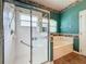 Bathroom featuring a glass-enclosed shower and soaking tub with tile surround at 3559 Chapel Hill Blvd, Clermont, FL 34711