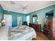 Inviting bedroom with hardwood floors, ceiling fan, and en-suite bathroom access at 3559 Chapel Hill Blvd, Clermont, FL 34711