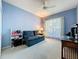 Bedroom featuring a blue couch, bright lighting and a ceiling fan at 3559 Chapel Hill Blvd, Clermont, FL 34711