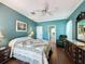 Charming bedroom with hardwood floors, ceiling fan, and en-suite bathroom access at 3559 Chapel Hill Blvd, Clermont, FL 34711