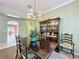 Dining room showcasing a dark wood table and a traditional china cabinet under chandelier lighting at 3559 Chapel Hill Blvd, Clermont, FL 34711