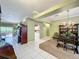 Open-concept layout featuring dining and living areas with large tile flooring and natural light at 3559 Chapel Hill Blvd, Clermont, FL 34711