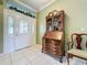 Welcoming foyer with a decorative door and a stylish hutch, blending classic and modern design elements at 3559 Chapel Hill Blvd, Clermont, FL 34711