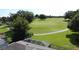 Scenic view of a golf course from the roof of a house with trees and blue sky at 3559 Chapel Hill Blvd, Clermont, FL 34711