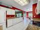 Open kitchen with white cabinets, granite countertops, and views of the breakfast nook at 3559 Chapel Hill Blvd, Clermont, FL 34711