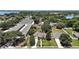 Picturesque aerial view of a residential area featuring well-maintained homes with lush landscaping and convenient storage units at 397 Anderson Dr, Tavares, FL 32778