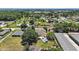 Expansive aerial view of a home featuring a pool, lush greenery, and a well-maintained landscape in a serene neighborhood at 397 Anderson Dr, Tavares, FL 32778