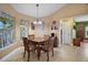 Cozy breakfast nook featuring a square wooden table, chair set, and bright natural light at 397 Anderson Dr, Tavares, FL 32778