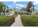 Inviting home with manicured front yard, features walkway, and well-maintained landscaping at 397 Anderson Dr, Tavares, FL 32778