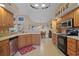 Well-lit kitchen featuring stainless steel appliances, tile backsplash, and an adjoining breakfast nook at 397 Anderson Dr, Tavares, FL 32778