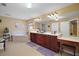 Bright main bathroom features a double vanity, makeup area, and a soaking tub with tile surround at 397 Anderson Dr, Tavares, FL 32778