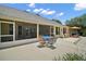 Inviting patio with outdoor seating, perfect for entertaining guests and enjoying the backyard view at 397 Anderson Dr, Tavares, FL 32778