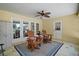Cozy covered porch with comfortable seating, creating an inviting space for relaxation and conversation at 397 Anderson Dr, Tavares, FL 32778