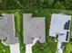 Aerial view of home, showcasing the roof, landscaping, and surrounding neighborhood at 4581 Shenandoah River Trl, Leesburg, FL 34748