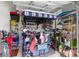 Garage features a golf cart with golf clubs, shelves with tools and equipment, with a roll up door at 4581 Shenandoah River Trl, Leesburg, FL 34748