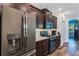 Well-equipped kitchen with stainless steel appliances and granite countertops at 4581 Shenandoah River Trl, Leesburg, FL 34748