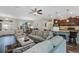Open-concept living room showcasing the kitchen, dining area, and comfortable seating at 4581 Shenandoah River Trl, Leesburg, FL 34748