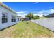Spacious backyard with a swing set, offering a great outdoor space for recreation and leisure at 4716 Block Island Ln, Clermont, FL 34714