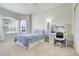 Well-lit bedroom features a desk, a bay window, and neutral carpet flooring at 4716 Block Island Ln, Clermont, FL 34714