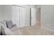 A spacious room with soft lighting, comfortable seating, and a closet, offering a welcoming space at 4716 Block Island Ln, Clermont, FL 34714