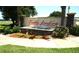 Community entrance sign for Tradd's Landing with decorative landscaping and a water feature at 4716 Block Island Ln, Clermont, FL 34714